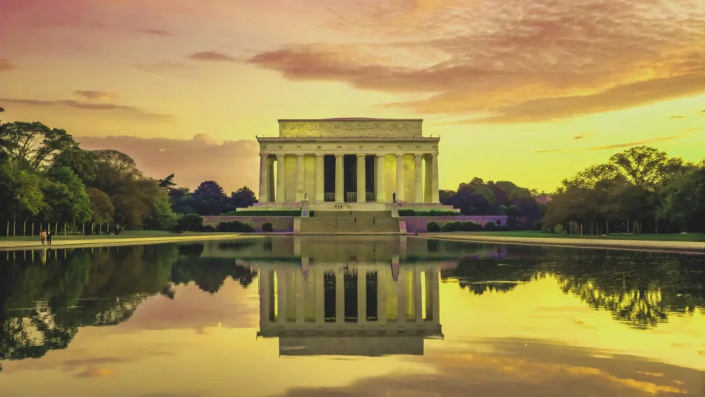 The Lincoln Memorial and Reflecting Pool at sunrise in Washington, D.C., a major stop on an east coast road trip.